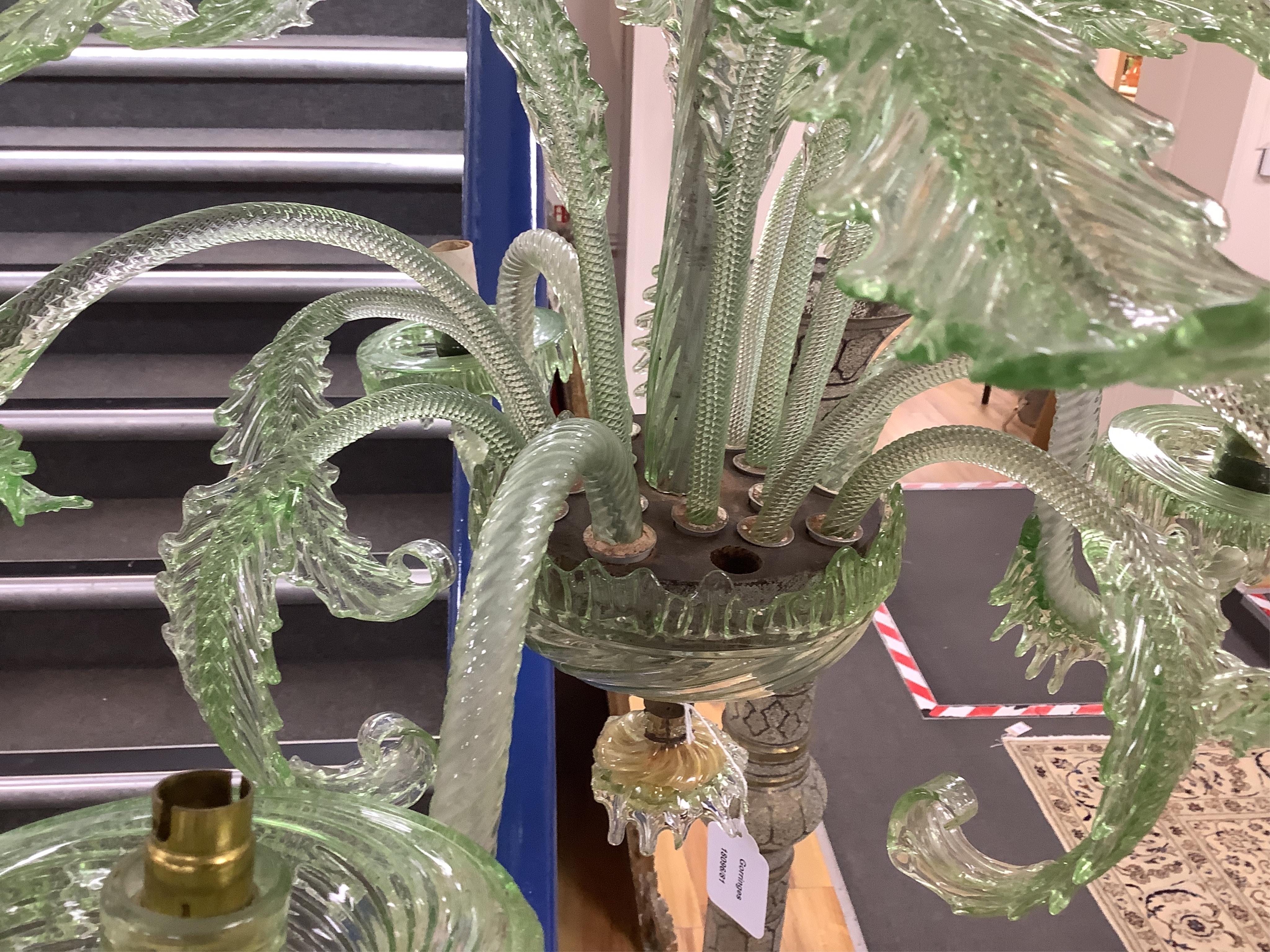 An ornate leaf and floral green glass Murano three branch chandelier, 84cm high.